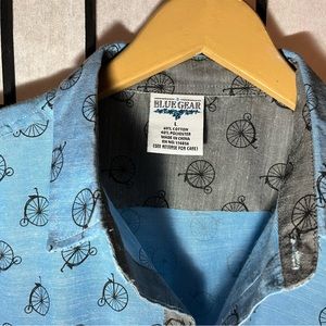Fun short-sleeve button-up with penny farthing bicycle print